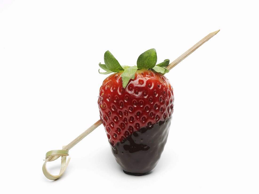 A chocolate strawberry on a kebab stick
