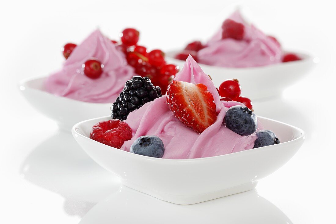 Berry yogurt ice cream garnished with fresh berries