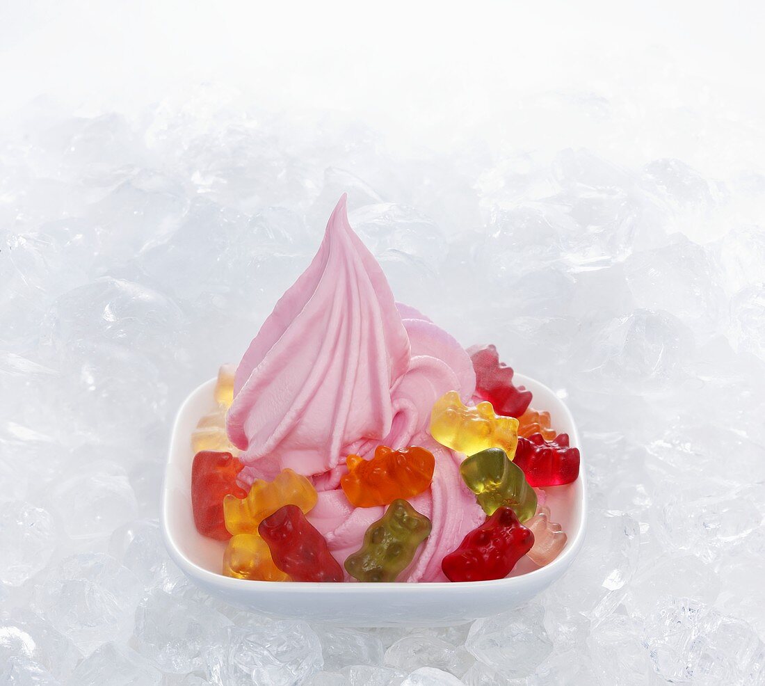 Strawberry yogurt ice cream garnished with gummy bears