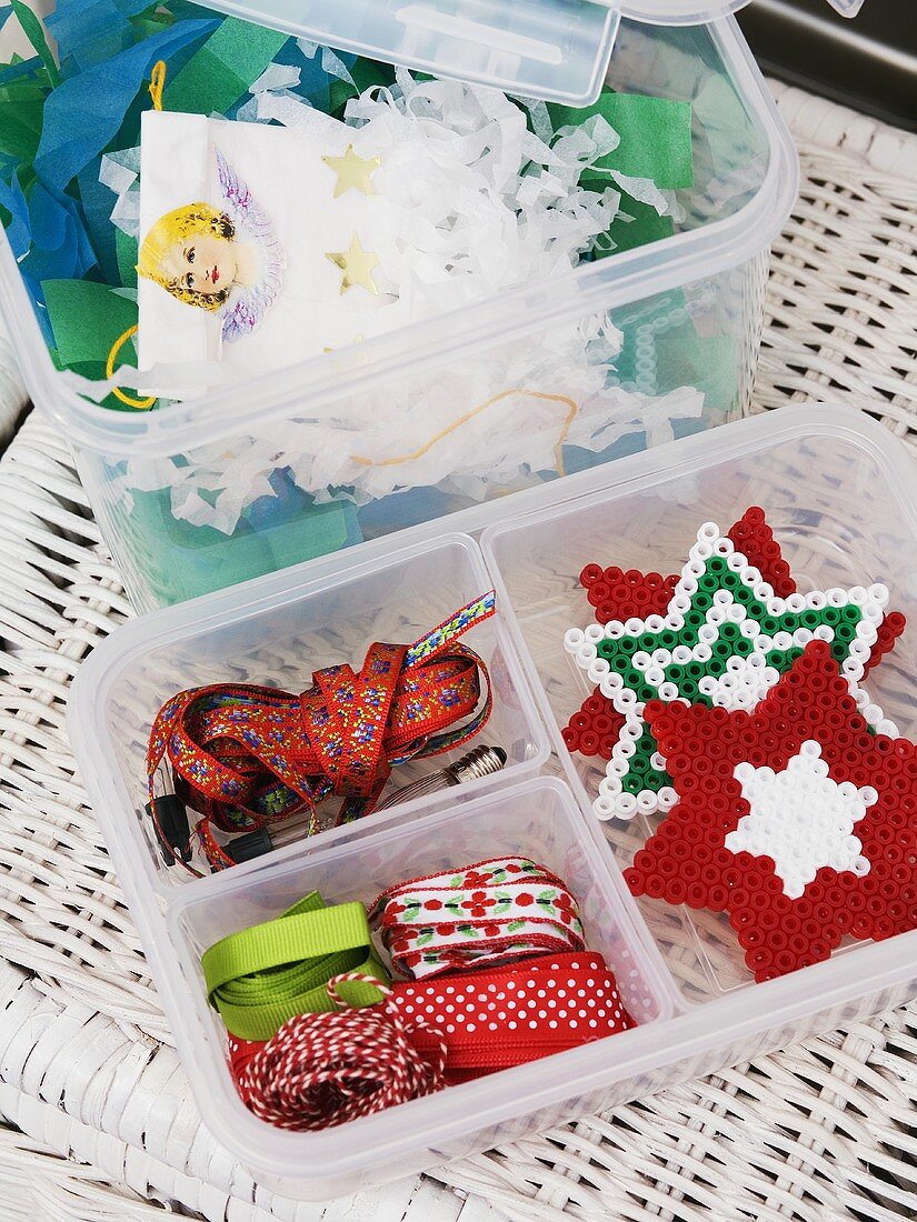 Christmas decorations and ribbons in a storage box