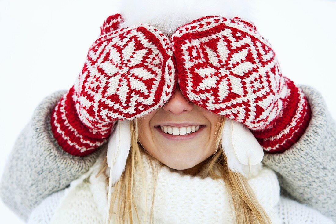 Young woman with her eyes covered