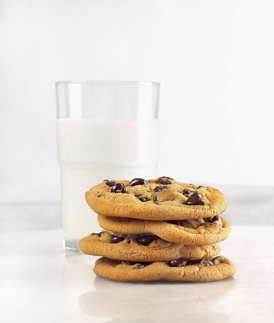 Milk and Cookies; Stack of Chocolate Chip Cookies with Glass of Milk