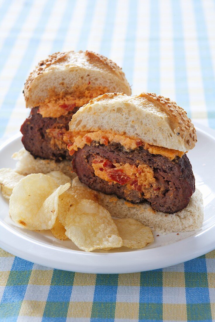 Pimento Burger; Burger Stuffed with Pimento Cheese; Halved on a Plate with Chips