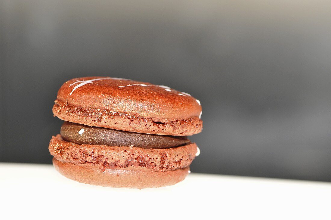 Orange macaroon with chocolate cream filling