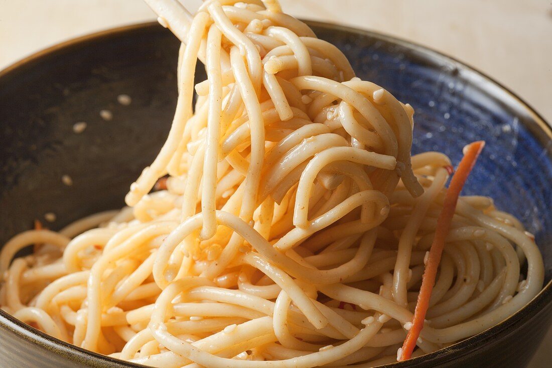 Cold Sesame Noodles in Bowl and Twirled on Chopsticks