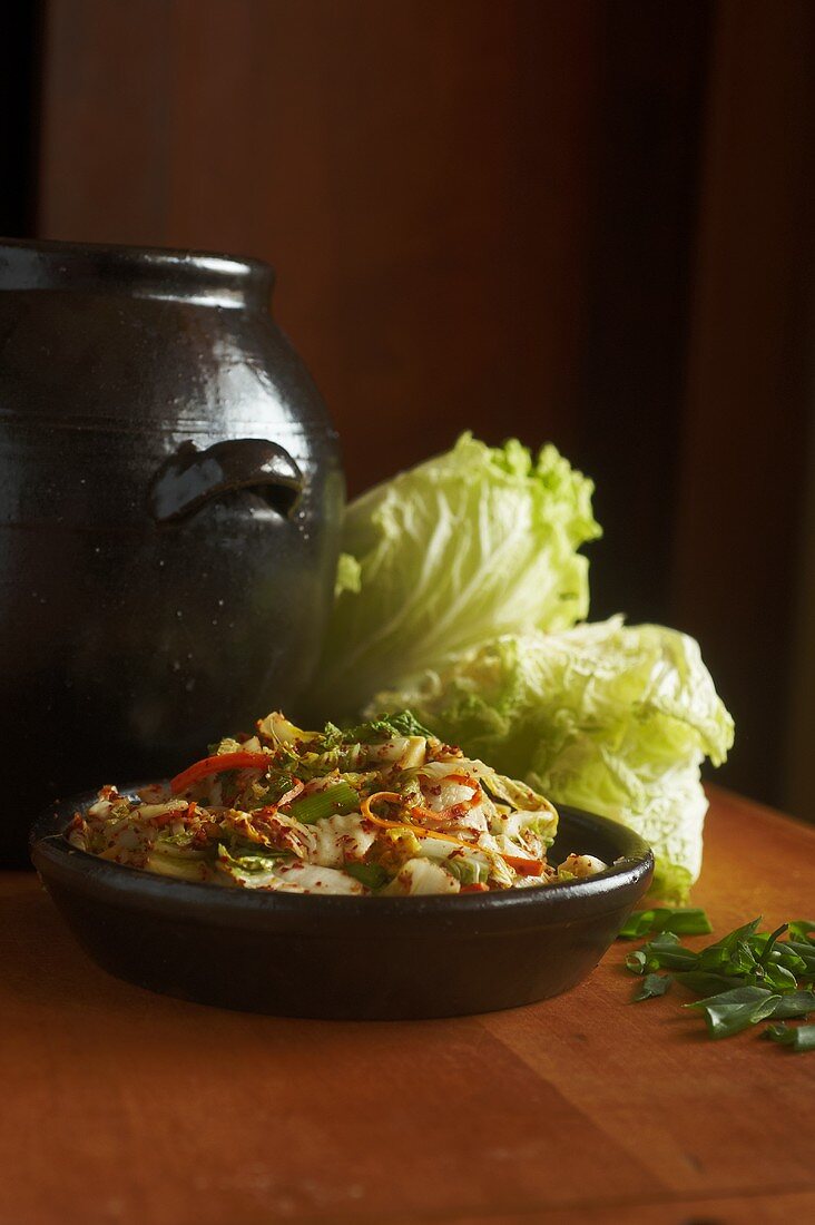 Kimchi in a bowl with fresh Chinese cabbage (Korea)