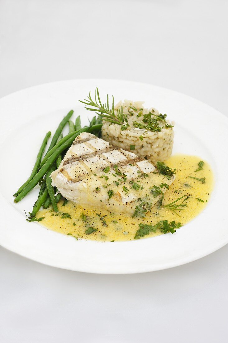 Grilled halibut with Hollandaise sauce, green beans and rice