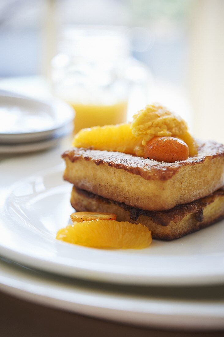 French Toast Made with Brioche; Topped with Marinated Oranges and Kumquats