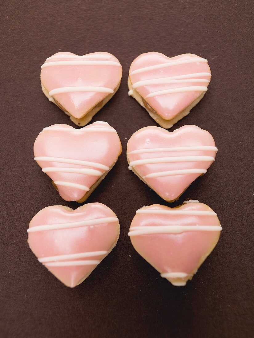 Pink heart biscuits filled with jam