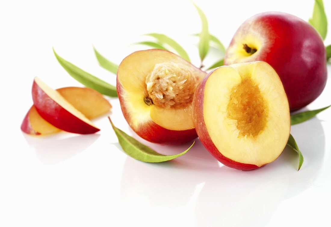 Nectarines, whole, halved and slices