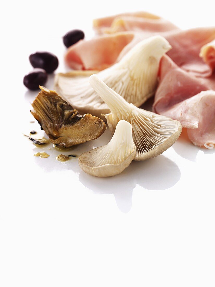Oyster mushrooms, artichokes, olives and ham