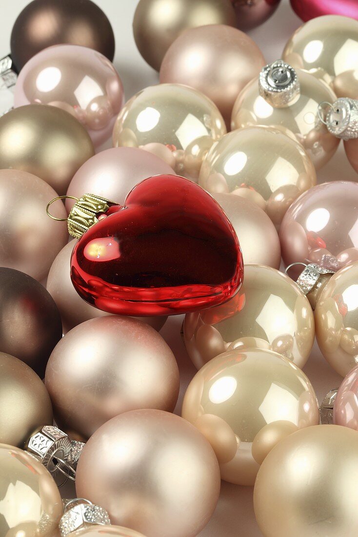 Pink Christmas baubles and a red heart