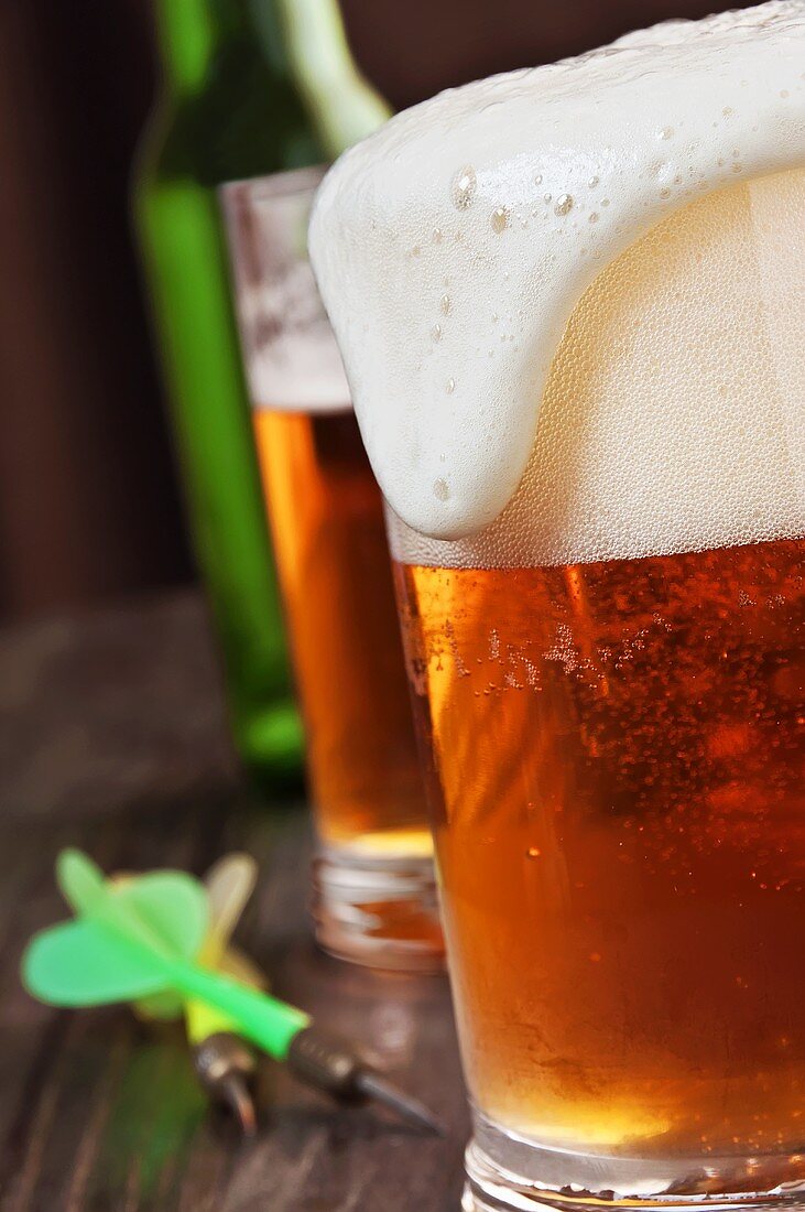 Foam Spilling Over the Top of a Glass of Beer