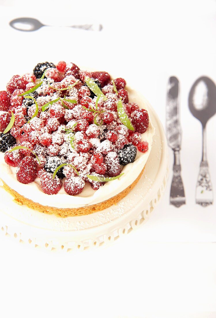 A berry tart dusted with icing sugar