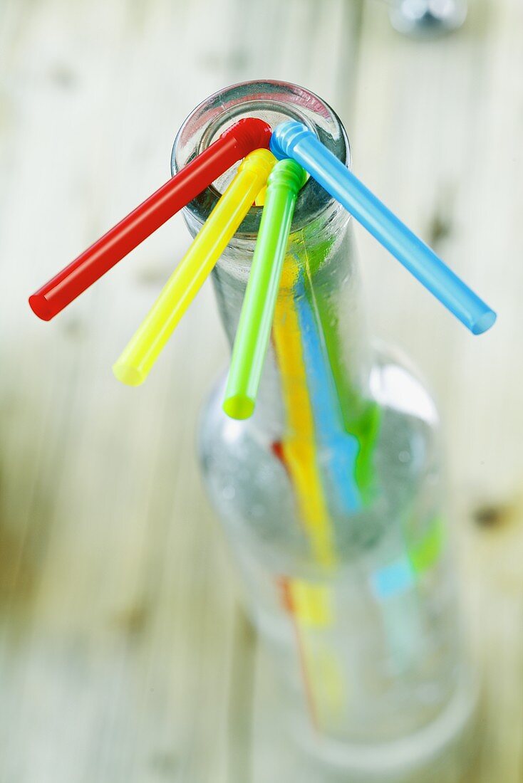 Straws in an empty bottle