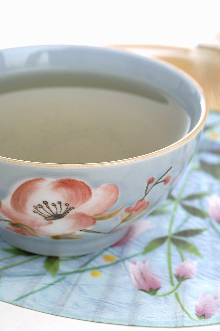 Tea in floral Asian teacup