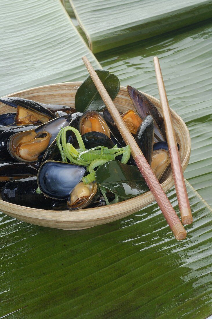 Mussels in dish with chopsticks
