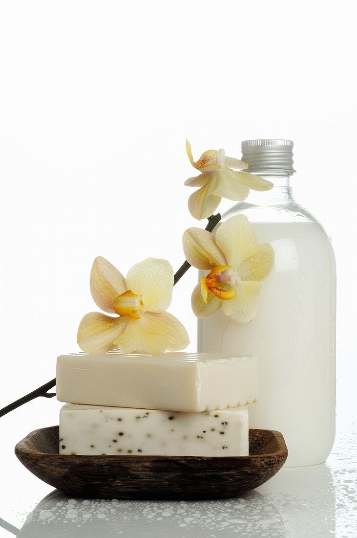Soaps, body lotion and orchid flowers