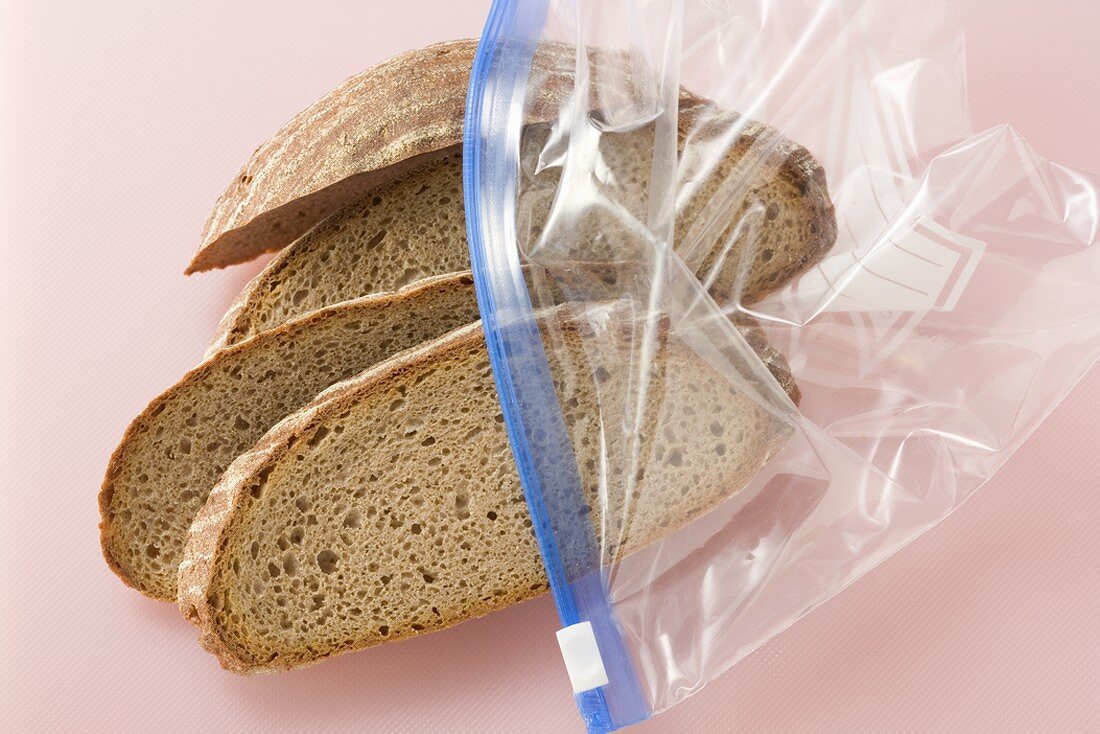Four slices of mixed wheat and rye bread in a plastic bag