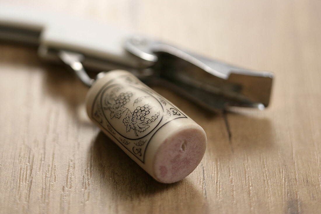 Wine cork with corkscrew