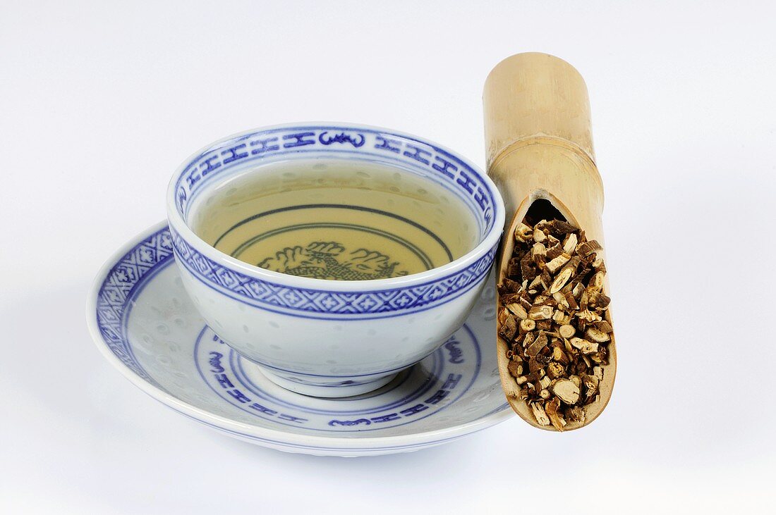 Bowl of tea with hare's ear root in a bamboo cane
