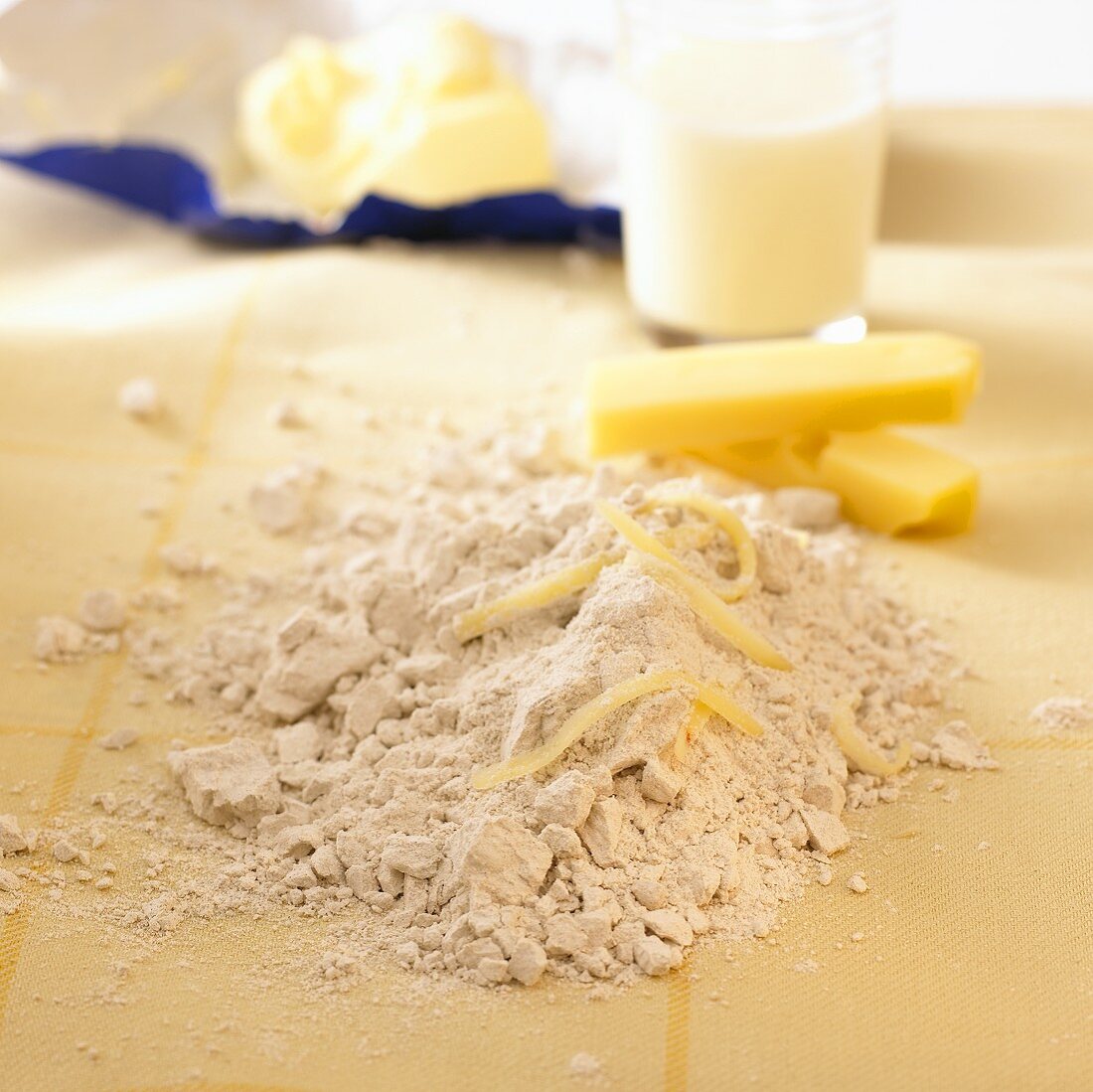 Baking ingredients: flour, milk, butter and cheese