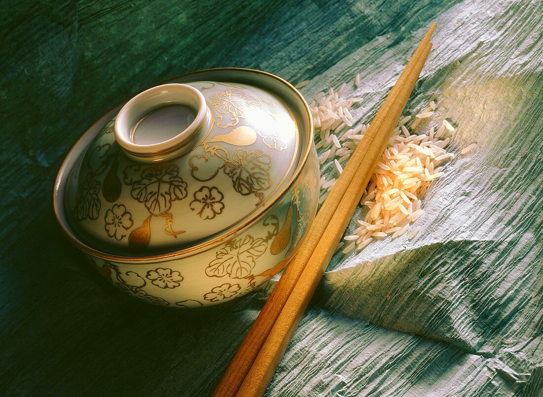 Painted rice bowl; chopsticks and rice