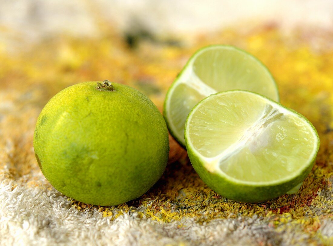 One whole and one halved lime