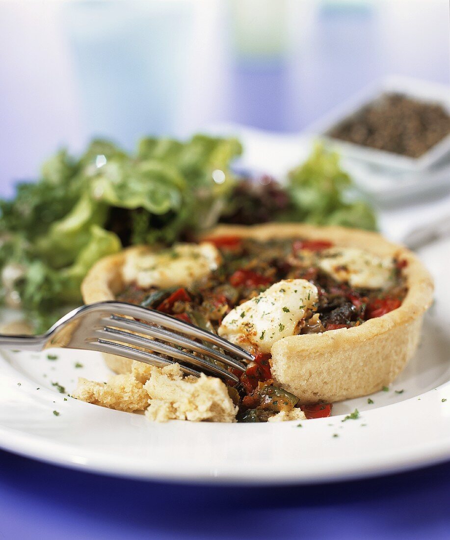 Mediterranean vegetable tart with mozzarella & salad leaves