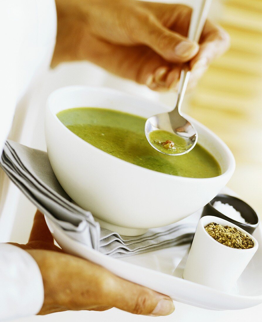 Chilled pea soup with diced bacon