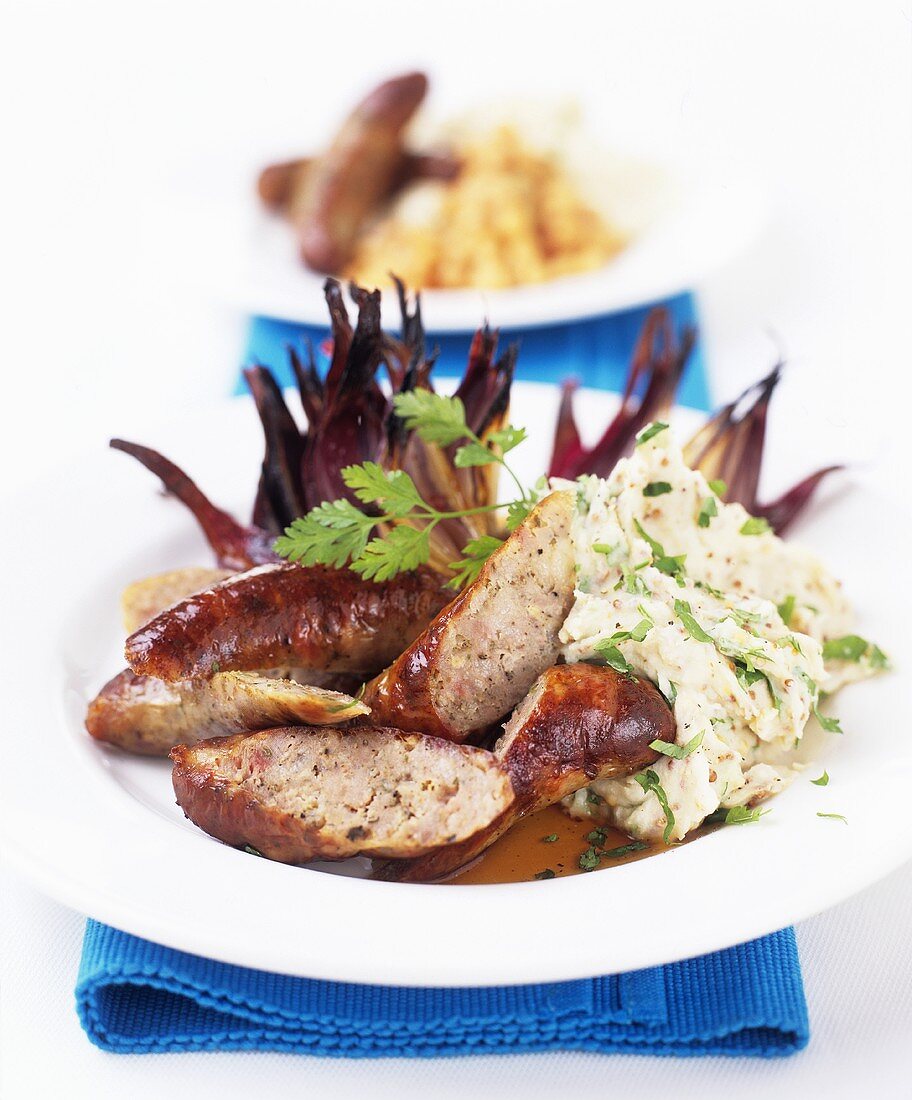 Sausages with mustard mashed potato and onions