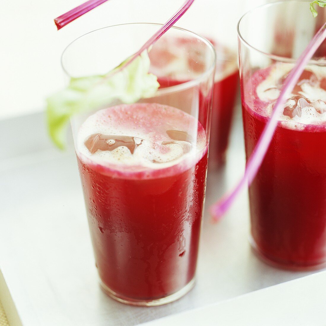 Beetroot, ginger and apple juice on ice