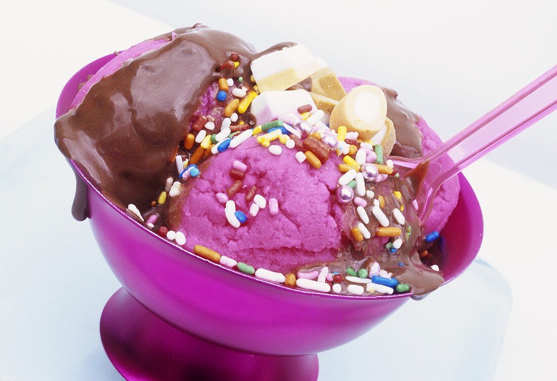 Pink ice cream with chocolate sauce
