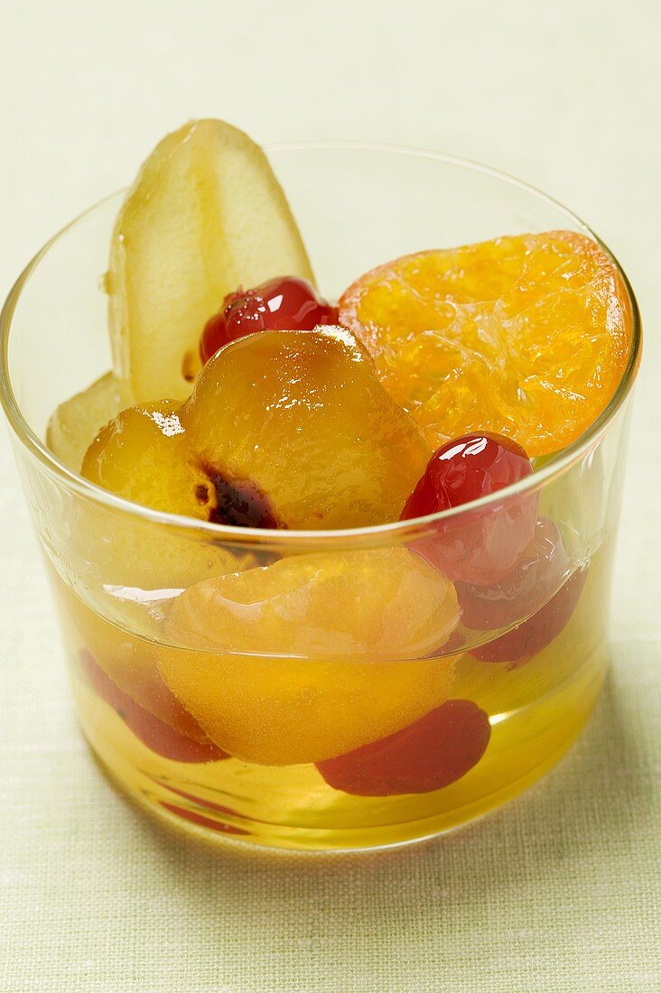 Candied fruit with mustard in glass