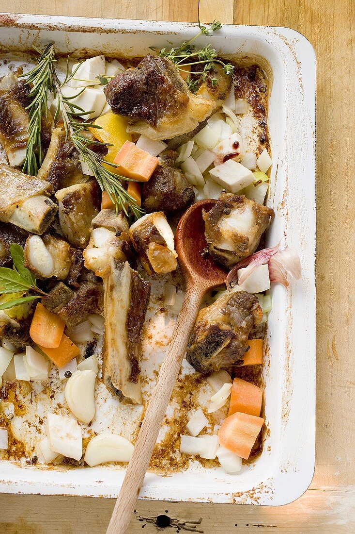 Roasted veal bones and vegetables (making veal stock)