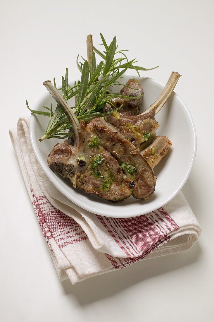 Grilled lamb cutlets with herb oil and rosemary
