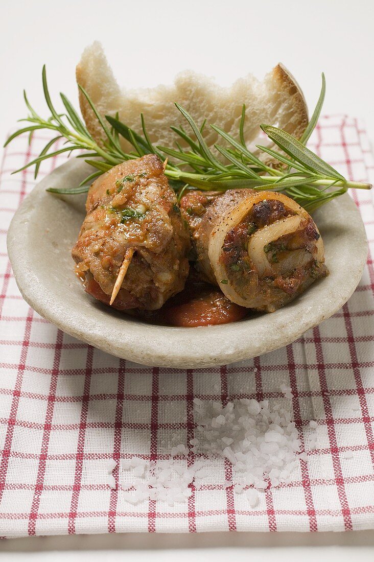 Belly pork rolls with tomato pesto and rosemary