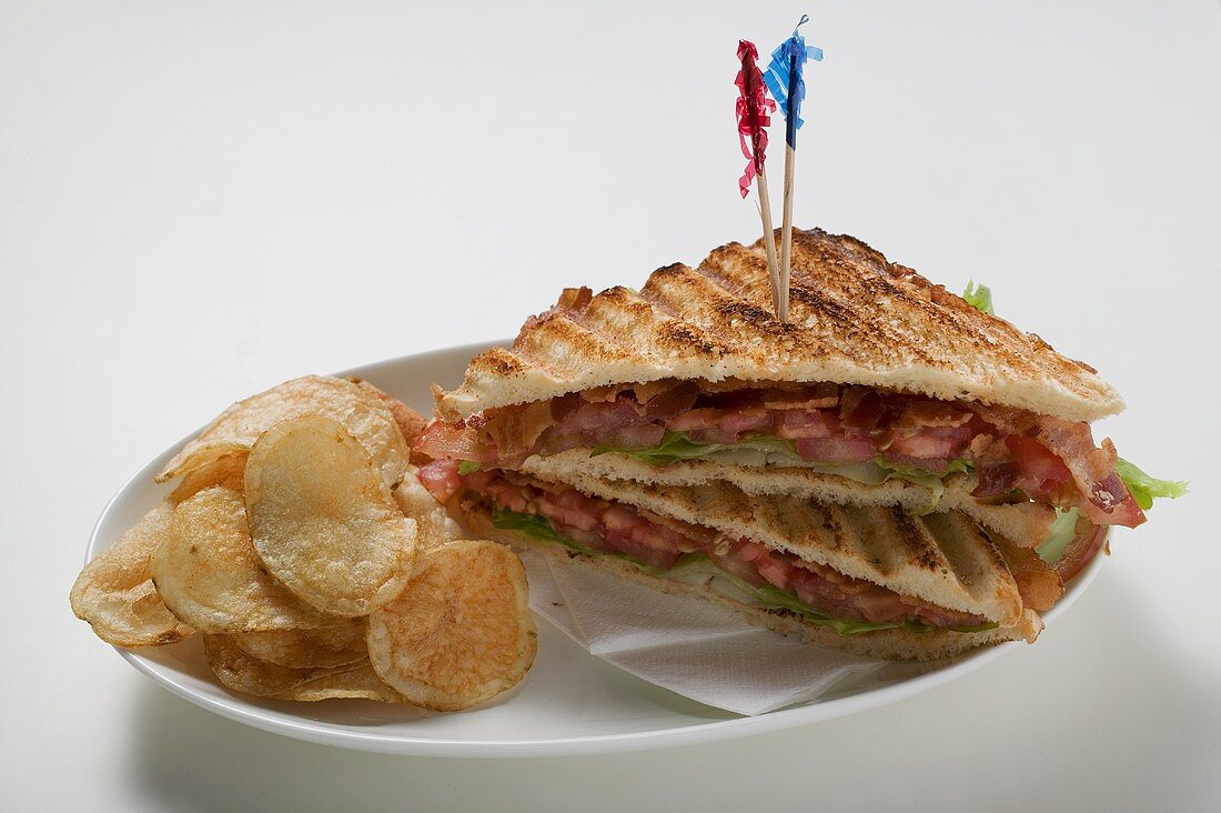 BLT sandwiches, toasted, with crisps