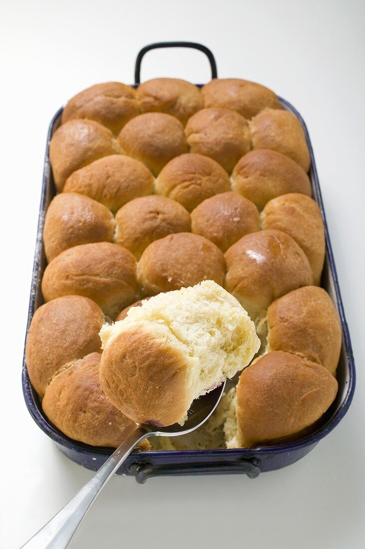 Sweet yeast dumplings (Buchteln) in a roasting tin