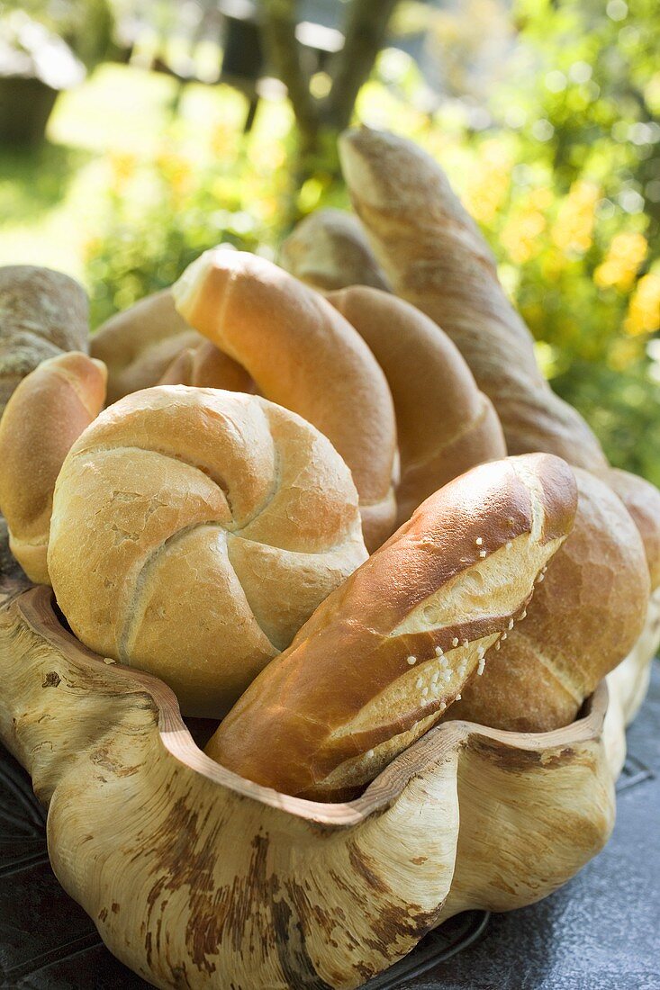Assorted bread rolls and croissants in bread basket
