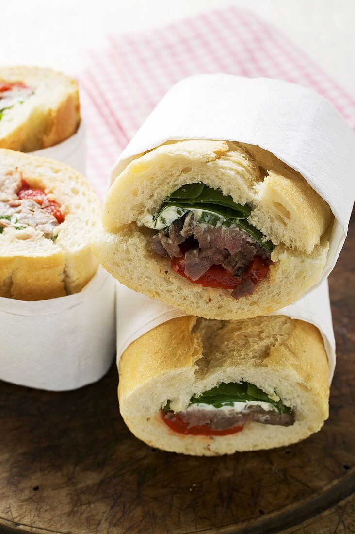 Sandwich rolls filled with pork and peppers