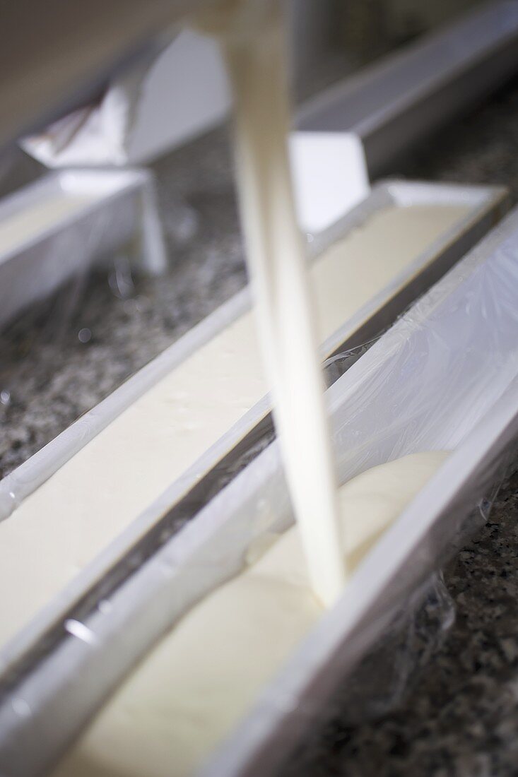 Pouring cream into terrine mould