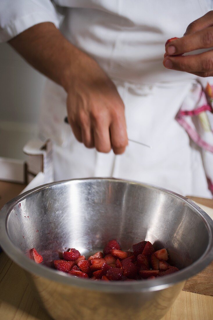 Chopping strawberries