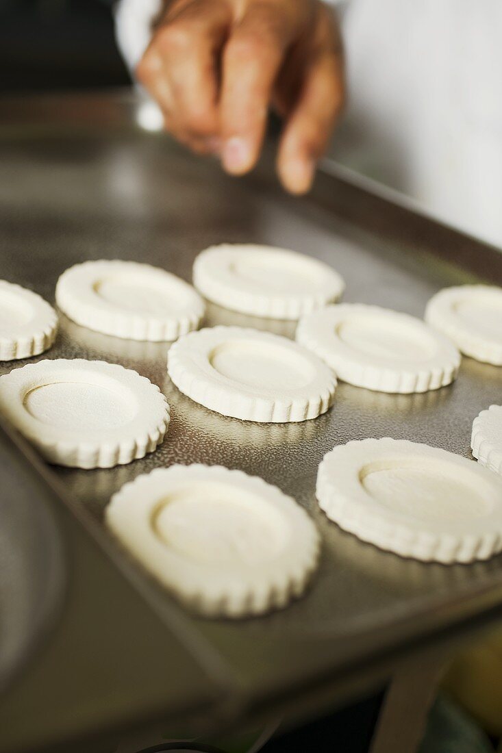 Laying tart cases on baking tray