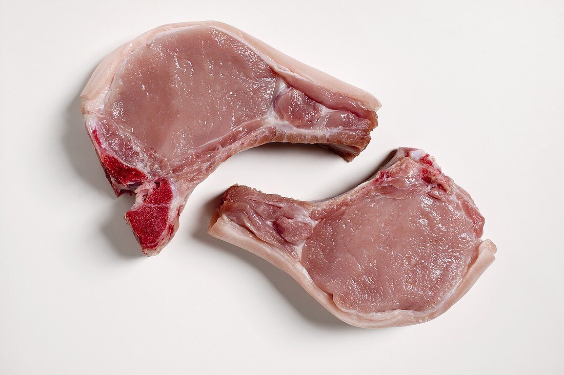 Two raw pork chops