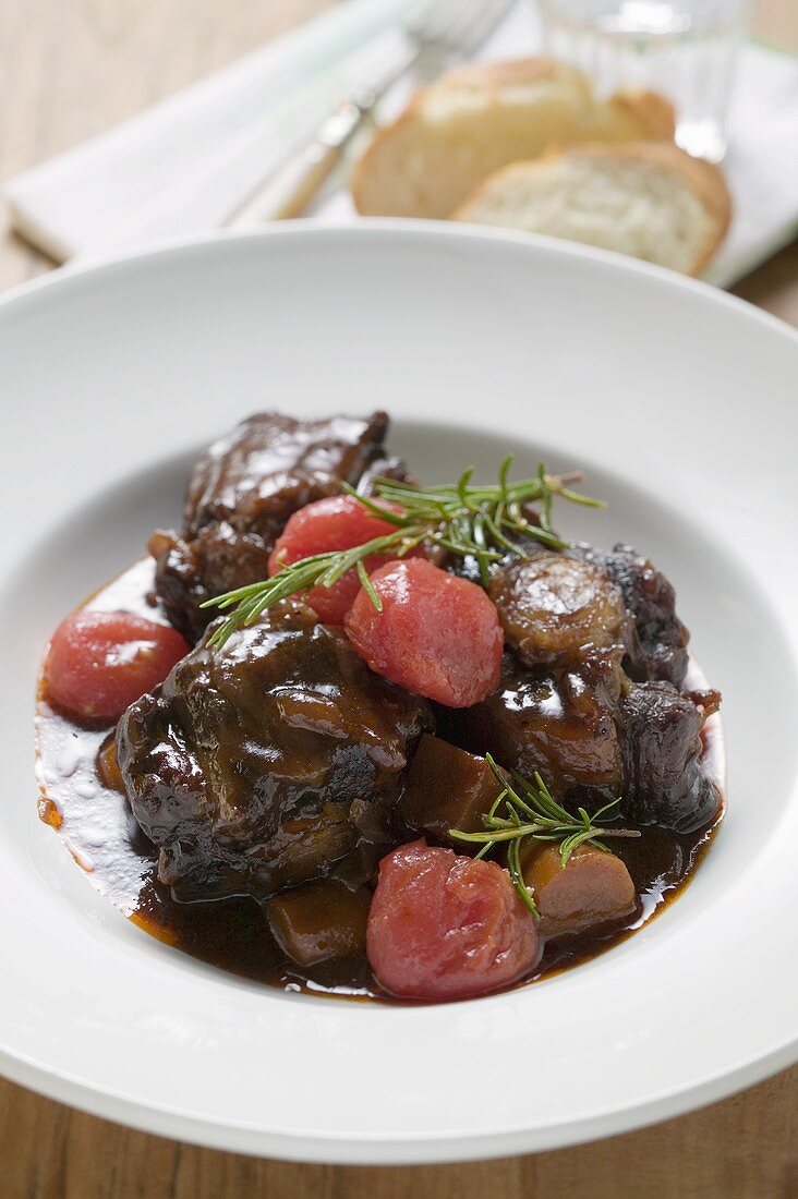 Braised oxtail with tomatoes and rosemary