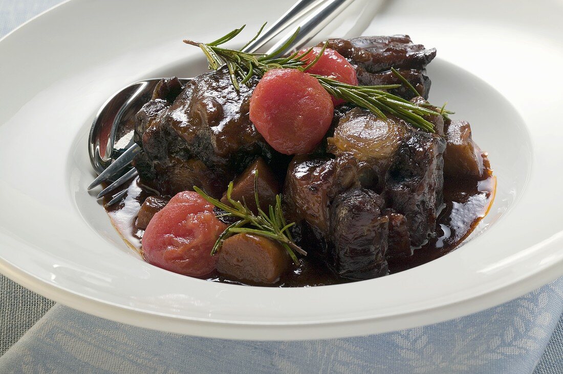 Braised oxtail with tomatoes and rosemary