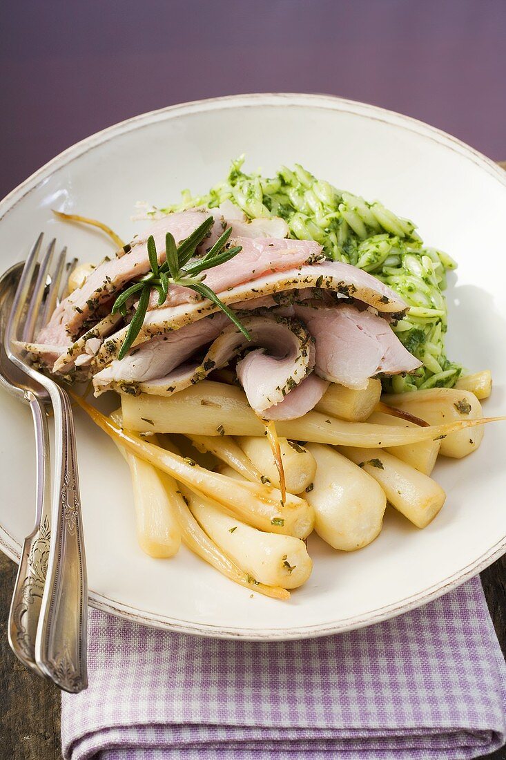 Rolled pork roast with parsley roots and orzo