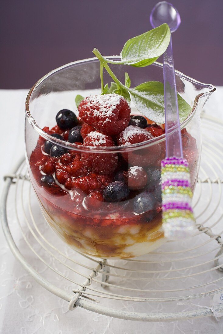 Rice pudding with berries and icing sugar