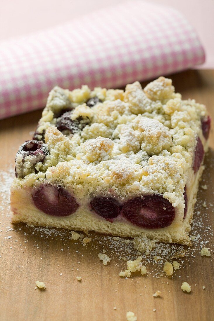 A piece of cherry crumble cake